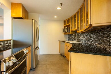 The beautiful kitchen features granite countertops