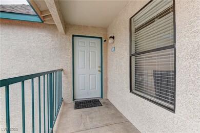 Doorway to property with stucco siding