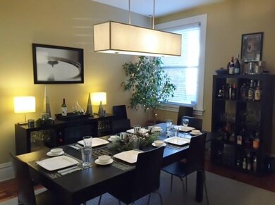 Spacious dining room with pine plank floors