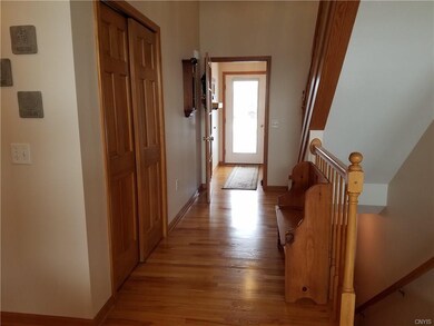 2 story foyer with gleaming hardwood floors.