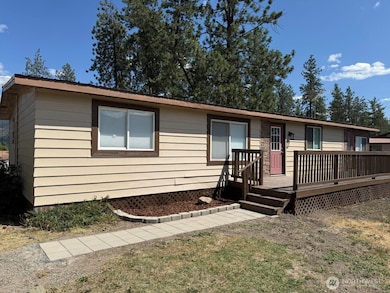 Large TREX deck on front of home