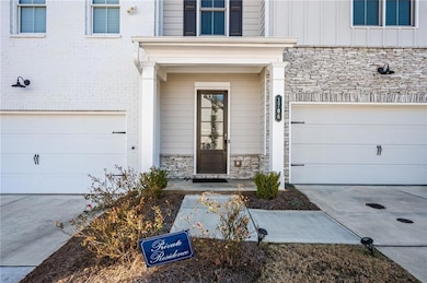 View of exterior entry featuring a garage