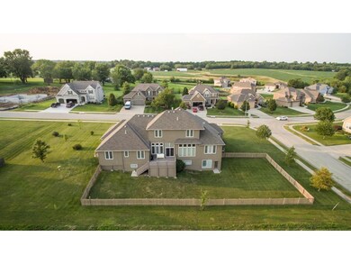 Drone View of the back of home has storage under d