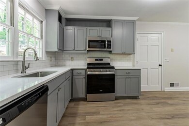 Kitchen with a sink, stainless steel appliances, c
