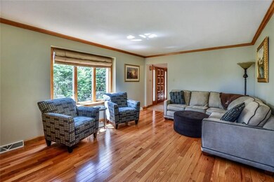 Spacious living room with gleaming hardwood floori
