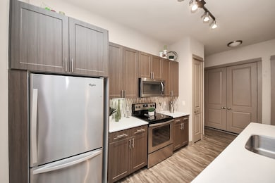 Photos are not of actual units, similar floor plan finishes, verify dimensions