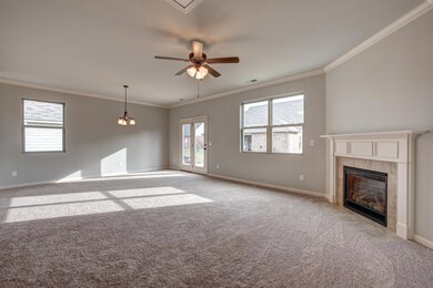 Great room view into breakfast.   Subject home will have hardwoods in all of this area.  All photos are of a similar home, not of actual property listed.