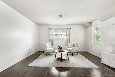 Living area featuring dark wood-style flooring and