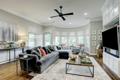 The high ceilings enhance the open, airy feel, com