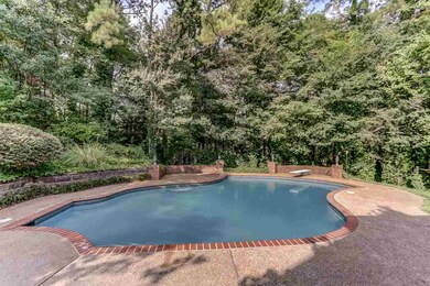 This .37 acre property features mature trees, as d