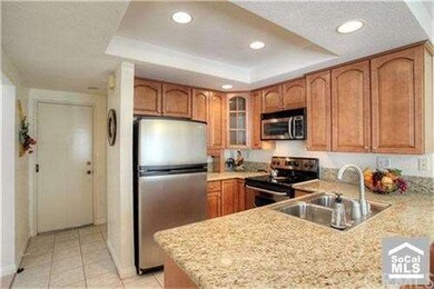 Updated Kitchen Boasts Tile Flooring, Attractive C