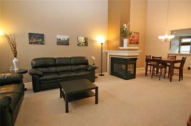 A 3-sided fireplace adds ambiance to the great roo