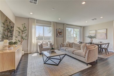 Living room featuring recessed lighting and dark w