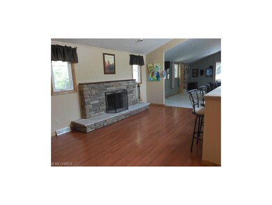 Fireplace in the kitchen area with space for a for