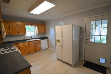 Kitchen looking at door to screen porch