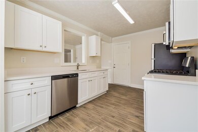 Kitchen with a sink, stainless steel appliances, w