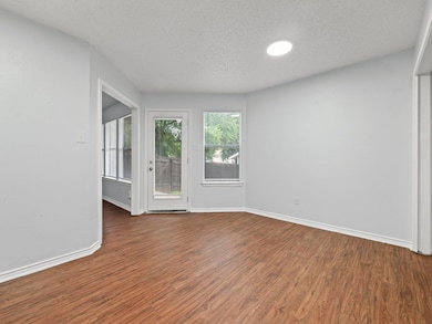 Unfurnished room featuring wood finished floors a