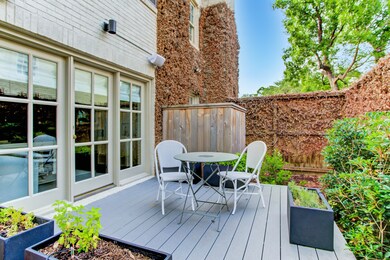 This outdoor seating area is the perfect spot for enjoying a cup of coffee in the mornings or a glass of wine with friends at night. Tucked away in its own little pocket, this side patio is the perfect place to escape for a bit of rest and relaxation.