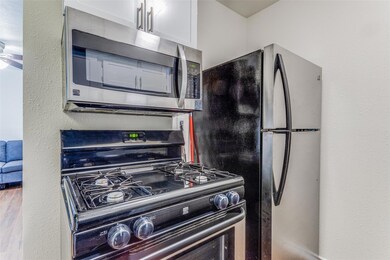 Kitchen featuring appliances with stainless steel