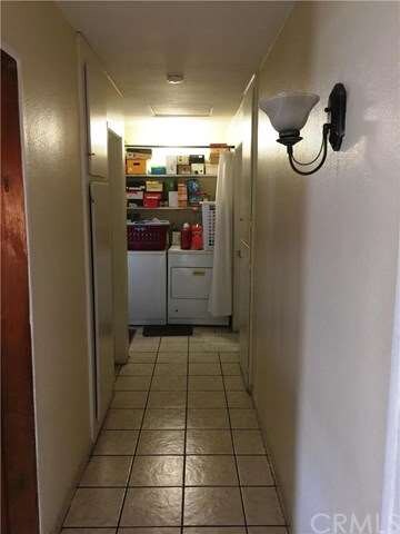 15735 Alwood - Hall leading to the bedrooms and laundry area.