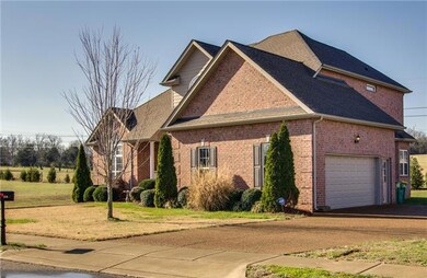 Side view of home with attached 2 car garage