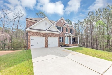 View of front of home with a front yard, a porch, 
