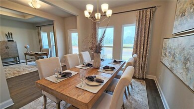 Dining space featuring a notable chandelier and da