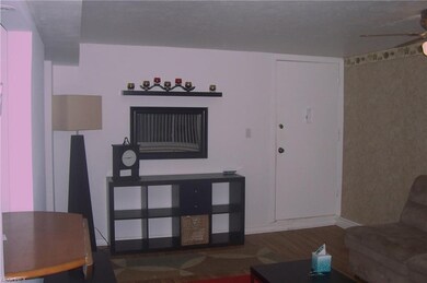 Large living room with newer wood laminate floorin