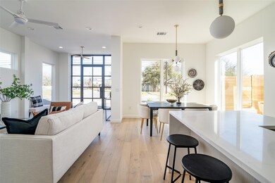 Living area with light wood-type flooring, visibl