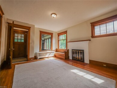 Living room looking back towards foyer and NE corn