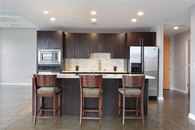 Chef's Kitchen with Marble Tile Backsplash