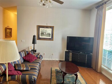Living room featuring plenty of natural light, har