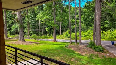 Property entrance with brick siding and ceiling fan