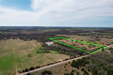 Birds eye view of property featuring a rural view