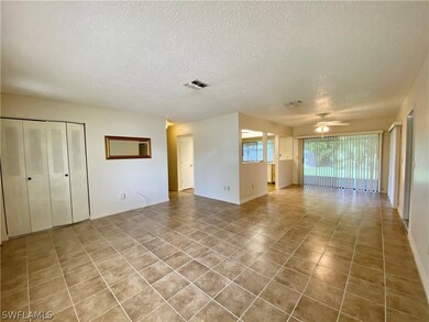Spacious living and dining room with a closet at e