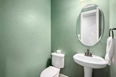 Half bath in a beautiful soft sage.