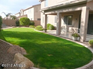 Large Covered Patio and Grassy Area
