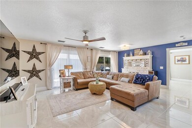 Open living areas with knock down finish on ceilin