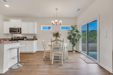 Dining space with visible vents, plenty of natural