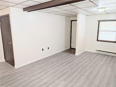 Apt #1 Living room w/ front entrance & closet (new