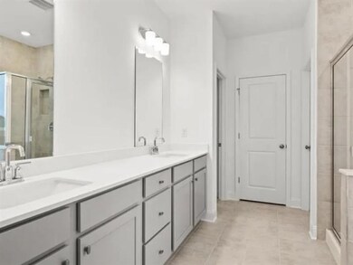 Full bathroom featuring a sink, tile patterned flo