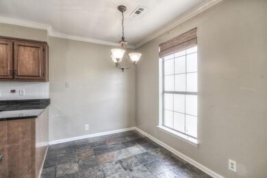 The Kitchen Features an Eat In Area.
