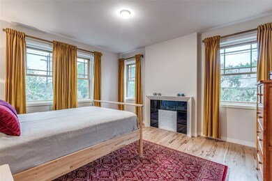 Primary suite with fireplace and lots of windows