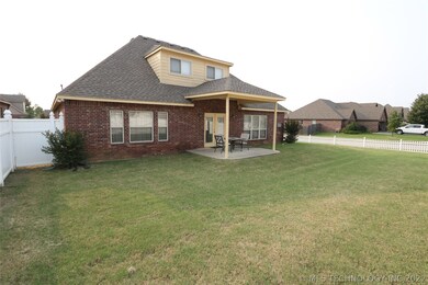 Back view of house and covered patio.