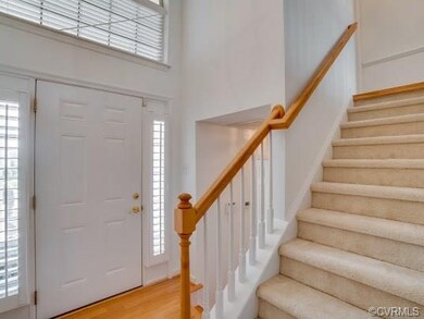 2-story Foyer with hardwood floor and plantation s