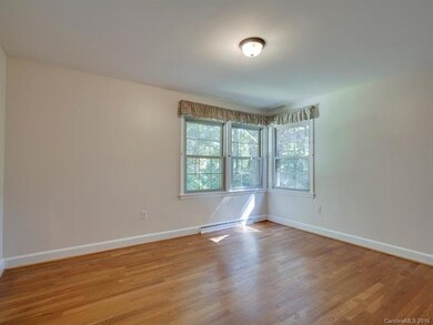 Main level bedroom #1 w original wood floors