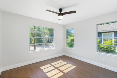 Spare room with dark hardwood / wood-style floorin