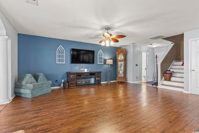 Living room featuring hardwood / wood-style floori