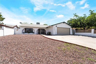 Single story home featuring concrete driveway, stu
