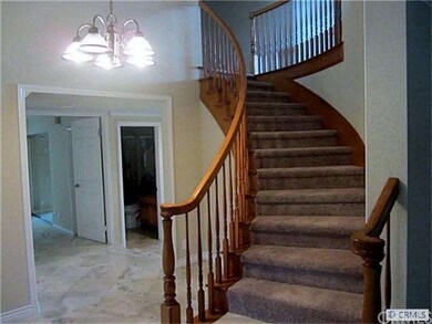 Front Entry- Curved Staircase